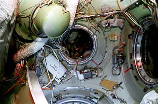 Interior views of the Mir space station including: docking node and entrance into the Prirorda module.